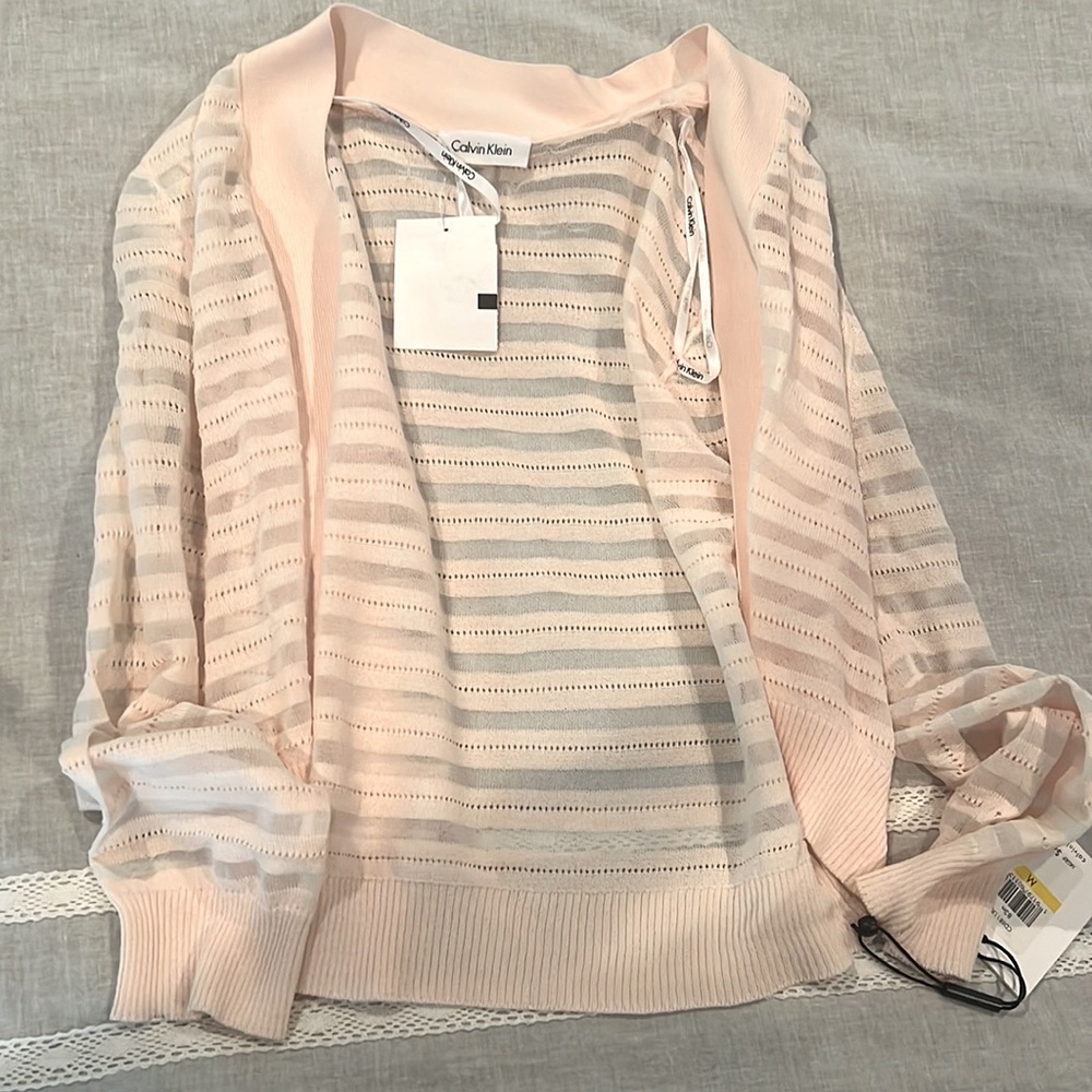 Pink cardigan from Calvin Klein that is brand new.